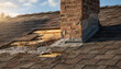 © Oleksandr - Damaged house roof with missing shingles and exposed wood near a brick chimney under a sunny sky, highlighting wear and repair need