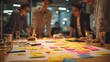 © WS Studio 1985 - Collaboration and Innovation: A team engages in collaborative brainstorming, surrounded by a vibrant array of sticky notes, papers, and sketches, symbolizing creativity and dynamic teamwork