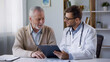 © Jennifer - Doctor Explaining Medical Report to Senior Patient in Clinic