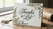 © Arlaya - Thanks a lot greeting card with scissors and twine on wooden table