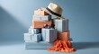 © SUMAYA AKTHER - Father's day gifts stacked up against light blue background with hat and sunglasses.