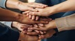 © Tapan - Diverse hands stacked together.