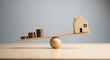 © fitria - A wooden seesaw balances stacks of coins against a small wooden house, illustrating financial concepts.