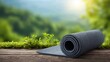 © Sawat - Rolled Yoga Mat on Wooden Surface with Green Nature Background for Wellness, Fitness, and Mindfulness Practices
