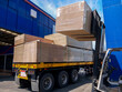 © chaiwat - Forklift loading stacks of plywood, PB and HDF boards. Unloading from the truck for storage in the warehouse. Industrial logistics, construction materials supply chain, and wood distribution concept.