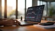 © silvia - Laptop displaying stock market chart data
