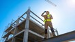 © Wahyu - Construction worker standing on steel beam at building site.