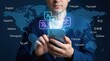 © tonstock - Businessman using a smartphone language translation app for global communication with a digital world map background.