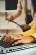© MIND AND I - Close-Up of Businesswoman Hands Typing on Laptop Keyboard at Desk