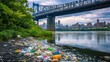 © MUHAMMADKHAIRILAMI - Industrial waste and colorful trash clog a polluted river beneath an urban bridge with city buildings in the background