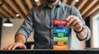 © Hamzah - Casual professional man stacking colorful vibrant wooden text blocks symbolizing creative pricing value and strategic profit building