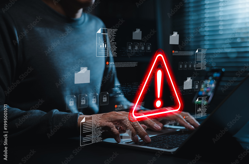 Cyber Risk Alert Data security warning and cyber risk alert concept. Person using laptop ...