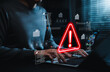 © Supatman - Data security warning and cyber risk alert concept. Person using laptop with digital files, lock icon, red warning symbol. data breach, document protection, threat detection, secure incident response