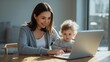 © Dream Studio - Mother and baby using laptop at home desk with natural light home office