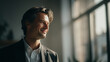 © Yaroslav Stepannikov - Businessman smiling softly, cinematic tones, natural window light, shallow depth, copy space on right