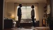 © Serhii - Tense argument at home: frustrated partners facing off in a modern living room