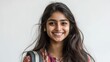 © CLARET - Smiling young Indian woman with long dark hair and expressive eyes, looking directly at camera against a clean white background.