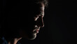 © siraphol - Male profile portrait with dramatic side lighting and moody expression