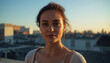 © siraphol - Young woman portrait golden hour soft directional light rooftop city background