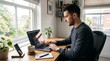 © Ivani - Young Man Working on Laptop at Home Desk