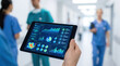 © Tin - Modern clinic management software health care administration concept. Healthcare professional examines data on a digital tablet.