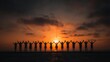 © Xiaoxiao - Group of people holding hands up in air with sunset sky background, unity teamwork celebration silhouette hope concept.