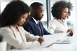 © Juan - Business team working together at desk reviewing documents collaboration planning and corporate productivity in office