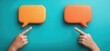 © Tyo - Two hands pointing at two empty orange speech bubbles on a teal background.