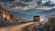 © Dewi - Massive Mining Truck Navigates Dusty Road in Open Pit Mine Landscape.