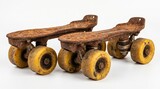 Rusted vintage metal quad roller skates with flaky orange oxidation and worn yellow wheels isolated on a white background