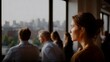 © Bussakon - A professional woman stands in thoughtful profile gazing out over a sprawling city skyline during a collaborative business meeting
