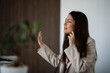 © Zoran Jesic - Woman communicating on phone while showing stop gesture