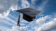 © Vanderlei - A graduation cap flies through the air against a blue sky with white clouds