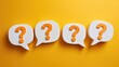 © Sahul - Four white speech bubbles with orange question marks are arranged in a row against a vibrant yellow background, creating a visually engaging and thought-provoking composition.