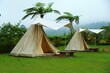 © ROHE Creative Studio - Glamping tents set in lush tropical garden, showcasing outdoor accommodation, eco tourism, and peaceful nature lifestyle.