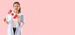 © Pixel-Shot - Young Asian woman holding flag of Canada on pink background with space for text
