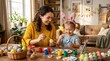 © horizon - Smiling young mother in a yellow sweater and her little daughter wearing pink bunny ears joyfully paint Easter eggs at a dining room table.