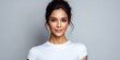 © NovaVision - Beautiful young woman with dark hair in a bun, wearing a white t-shirt, looking at the camera