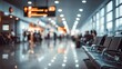 © Akbar - Blurred airport terminal with passengers waiting in a modern, well-lit concourse.