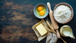 © hamad - Fresh raw ingredients including wheat flour, cracked eggs, creamy butter, milk and a wooden rolling pin for baking delicious pastries