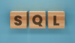 © Grid Byte Studio - SQL Database Management Theme Featuring Wooden Alphabet Blocks Symbolizing Data Storage Query Processing Information Systems And Technology Solutions