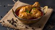 © HasibMahamud - Indian chicken curry in an antique brass pot