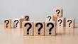 © Zihan Mia - Wooden blocks with question marks arranged to represent uncertainty and decision making challenges