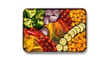 Assorted vegetables arranged on a tray with a white background
