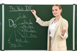 © New Africa - English teacher during lesson near chalkboard in classroom