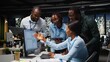 © DC Studio - Black team of male consultants reviewing data analytics on desktop, building a vision and business strategy to accomplish objectives and success. Mindset for teamwork late at night.