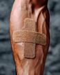 © AnasTruba - Close-up view of a bandage on an arm after donating blood, showcasing warmth and care in a selfless act of giving. World Blood Donor Day