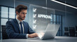 © Sajal.savar - A businessman intently focuses on his laptop with a holographic 'approval' display floating above the screen symbolizing digital progress