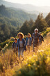 © Benjaporn - Happy multigenerational family hiking in nature showcasing vitality lifestyle longevity wellness and active healthy living concept