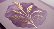 © Narongsag - Gold line art illustration of a botanical branch printed on textured purple paper
